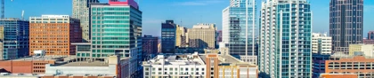 Downtown Raleigh skyline with modern high-rise buildings under a clear blue sky