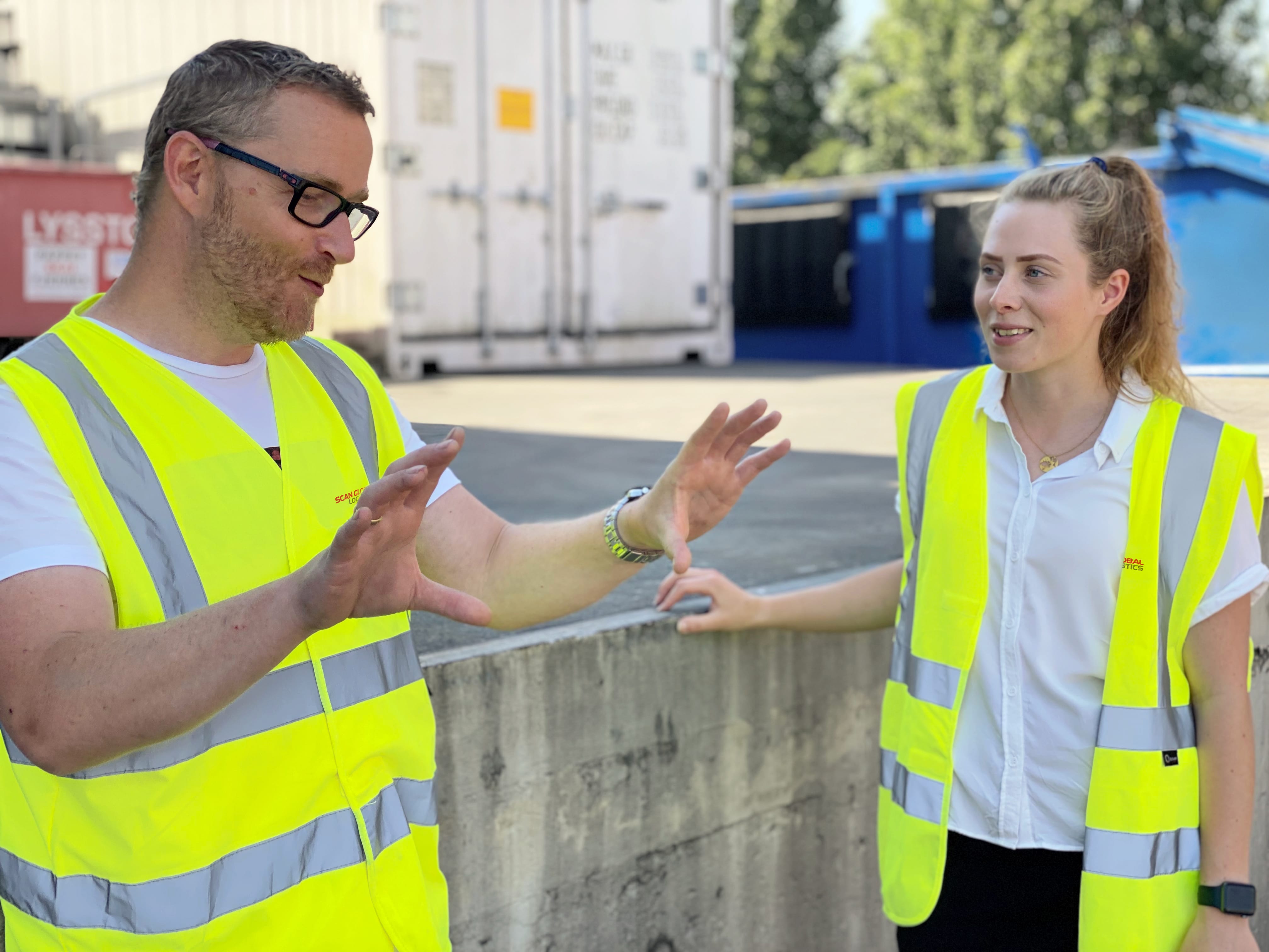 sgl-employees-discussing-logistics