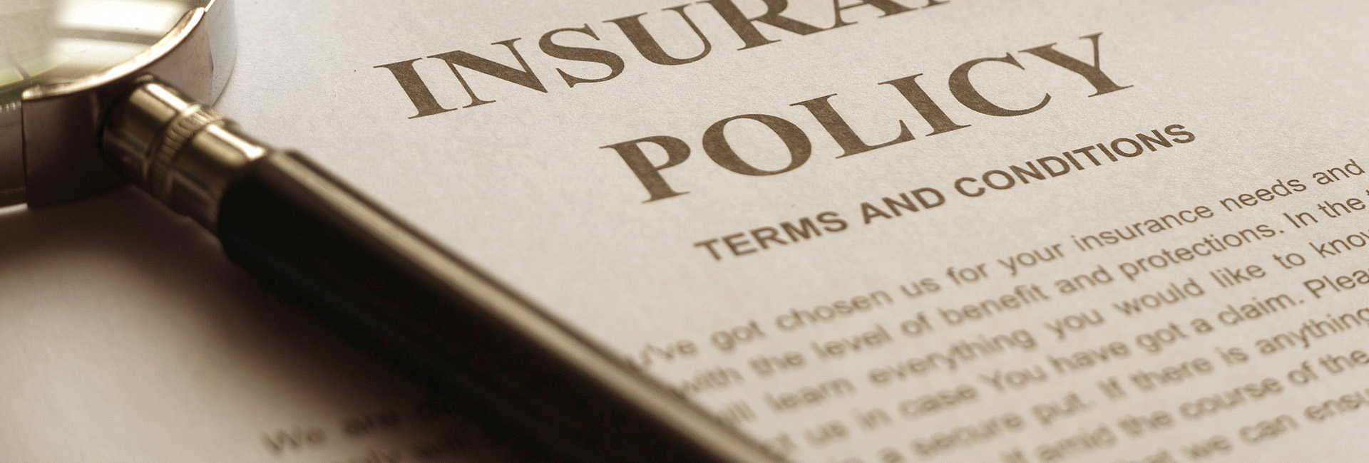 insurance-policy-document-magnifying-glass