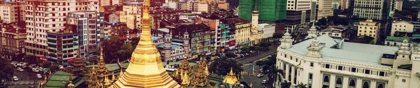 The golden Sule Pagoda surrounded by modern buildings and bustling streets in Yangon, Myanmar