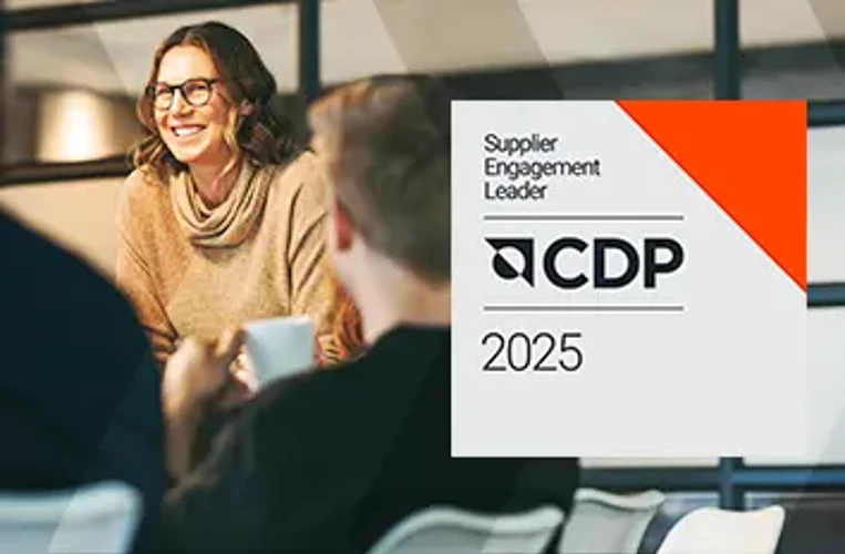 CDP Supplier Engagement Leader 2025 recognition displayed beside a business meeting.