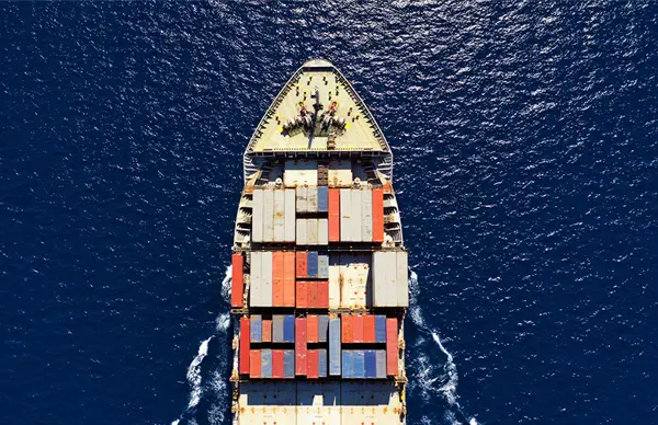 container ship with cargo sailing in the ocean