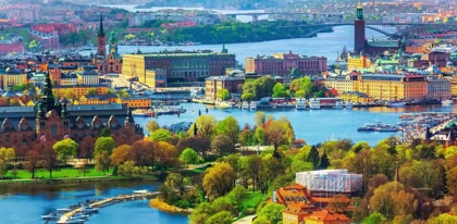 Panoramic view of Stockholm, Sweden, with waterways, historic buildings, bridges and green parks.